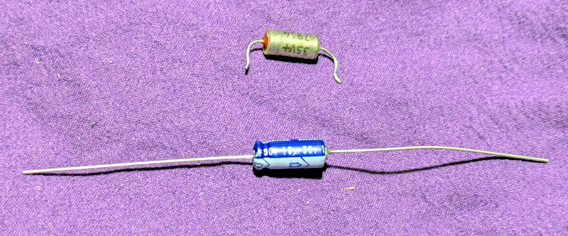 [Really bad picture of the bad capacitor and its replacement.]