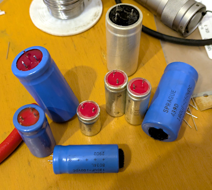 [Really bad picture of the old capacitors