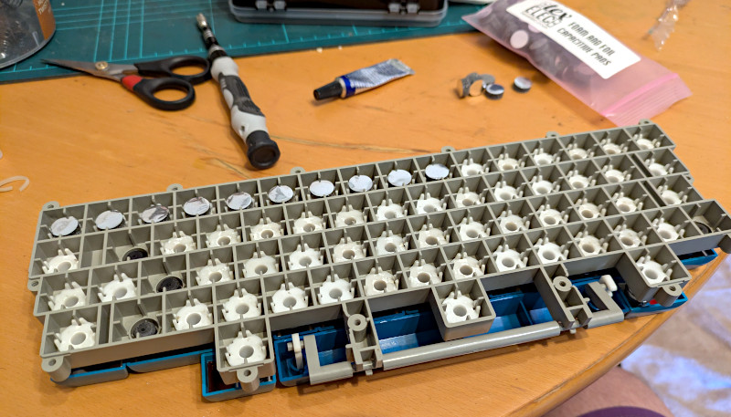 [Really bad picture of glued pads in the keyboard]